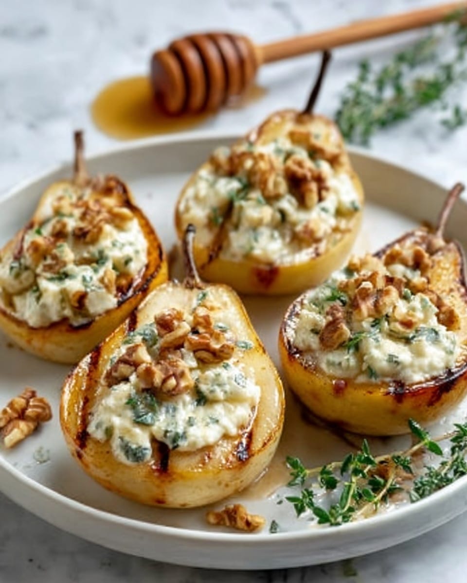 The image shows four pear halves placed on a white plate, each hollowed and filled with a creamy white cheese mixture with small green herb pieces. The pears have a golden-brown grilled texture on top. On the cheese mixture, there are scattered chopped walnuts adding a rough, crunchy look. Small sprigs of fresh green herbs and a wooden honey dipper with honey are visible in the background on a white marbled surface. photo taken with an iphone --ar 4:5 --v 7