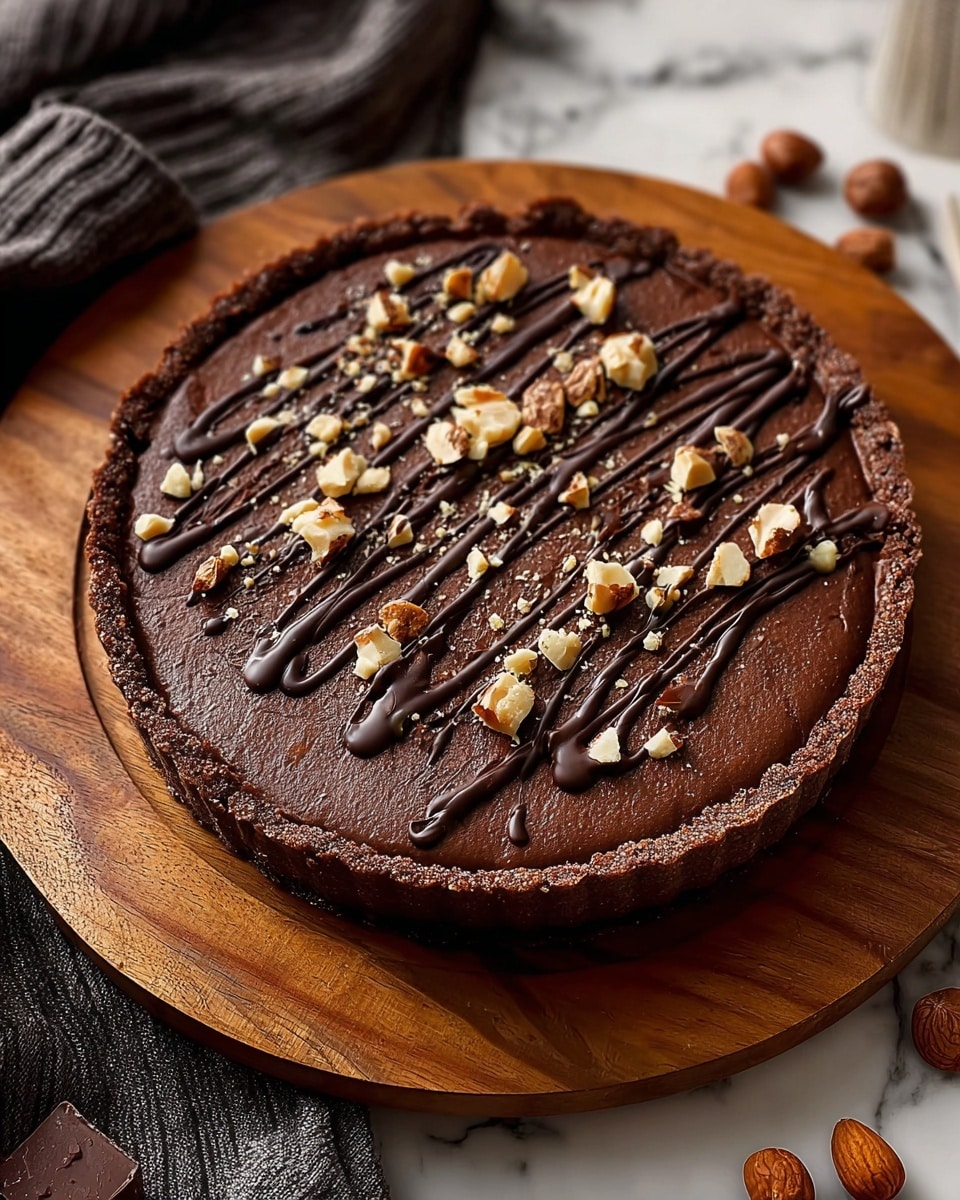 A close-up view of a pie slice with three distinct layers placed on a white plate over a white marbled texture. The bottom layer is a crumbly, golden brown crust with small bits visible, giving it a crunchy look. The middle layer is a thick, smooth dark chocolate filling with a shiny surface. The top layer is a light cream color covered with shredded coconut flakes that add a fibrous texture, and it is decorated with whole pecans evenly spaced on top. The edges of the crust are slightly rough and crimped. photo taken with an iphone --ar 4:5 --v 7