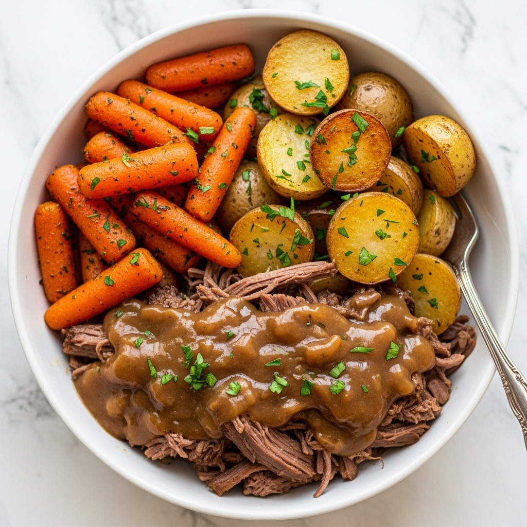A white bowl filled with a hearty dish, showing three main layers. At the bottom, there is a layer of shredded beef covered generously with brown gravy that looks juicy and tender, garnished with small green herb pieces. To the upper left, a cluster of shiny orange baby carrots coated with herbs adds a pop of color. On the upper right, there are golden brown round potatoes sprinkled with chopped green herbs. The bowl rests on a white marbled surface with a silver fork placed at the edge of the bowl. photo taken with an iphone --ar 4:5 --v 7