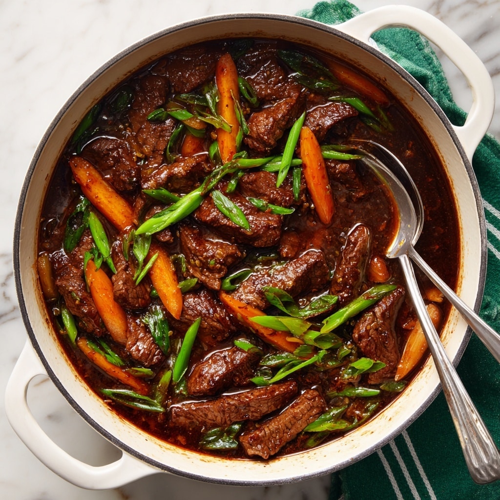 A white pot filled with a dark brown beef stir-fry sauce holding several slices of cooked beef that are rich brown and glossy in texture. Mixed in are bright orange carrot strips and vibrant green pieces of scallion, adding contrast to the dish. The sauce is thick and shiny, coating the beef and vegetables evenly. Two silver spoons rest inside the pot on the right side, partially submerged in the mixture. The pot is set on a white marbled surface with a green and white striped cloth partially visible underneath. photo taken with an iphone --ar 4:5 --v 7