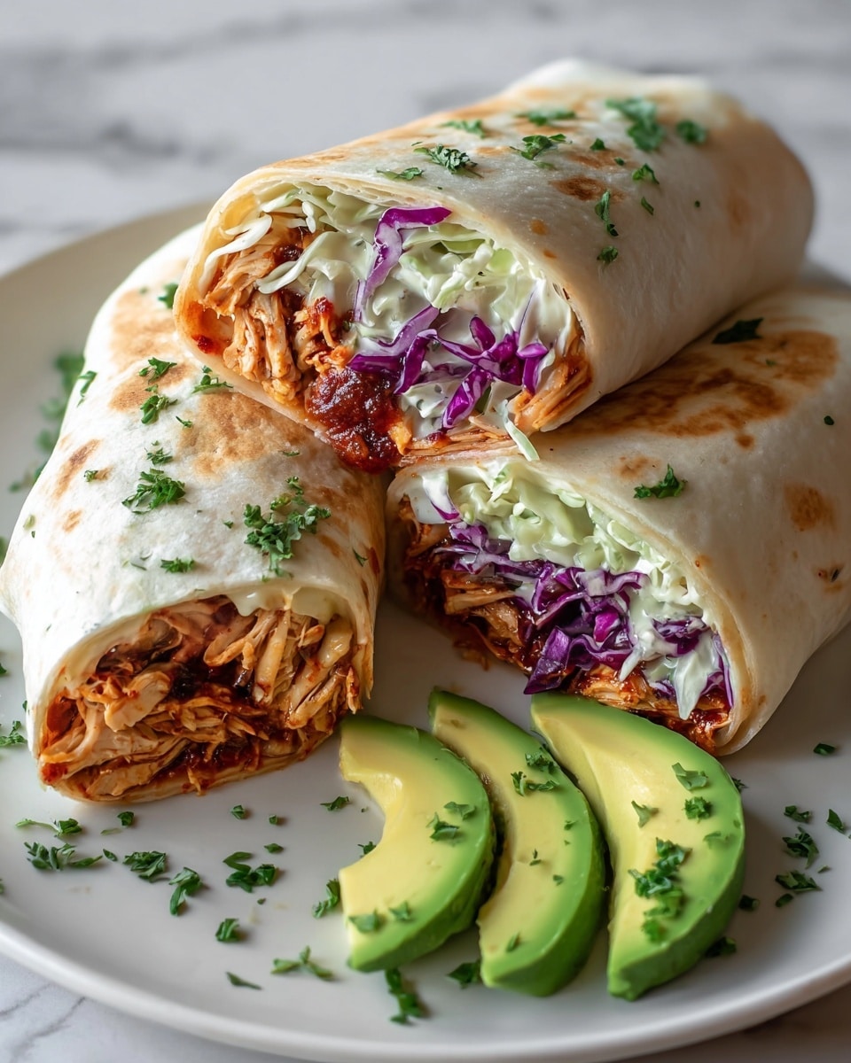 The image shows two burritos wrapped with a soft, slightly toasted light beige tortilla, cut in half to reveal the colorful filling inside. The filling has three visible layers: the innermost layer with shredded light brown chicken mixed with a dark reddish sauce, the middle layer with chopped purple and green cabbage mixed with a white creamy sauce, and the outer layer of the tortilla wrapping it all tightly. The burritos are placed on a white plate, with three slices of bright green avocado garnished with small green herb pieces on the side. Some green herb pieces are sprinkled on the burritos and plate for decoration, all set against a white marbled surface. photo taken with an iphone --ar 4:5 --v 7